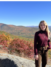 Sophie on a mountain with colorful autumn leaves